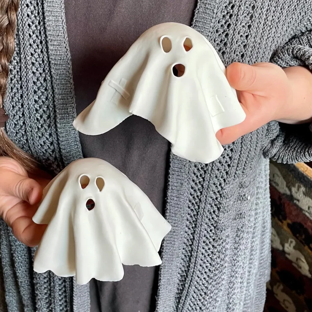 Translucent Porcelain Ghosts with Howling Faces – Spooky Draped Figures